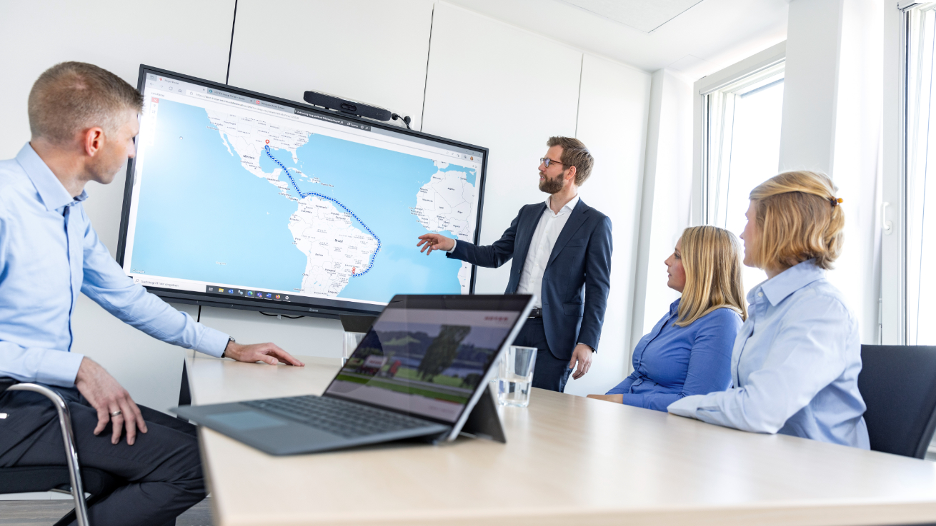 HOYER Group employees discussing in the meeting room